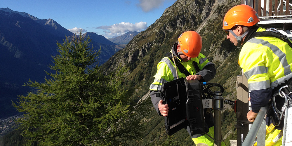 Technicians from Orange Unité Alpes carry out maintenance on the webcam that measures vegetation greening at Planpraz